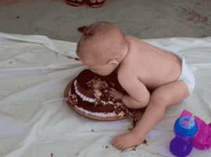 baby-eating-birthday cake
