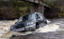 Subaru car swept away down river in flood