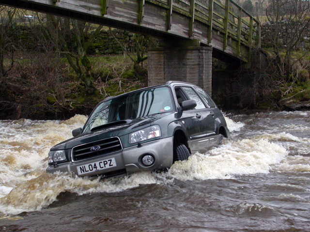 Subaru car swept away down river in flood